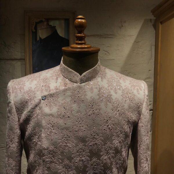 An asymmetrical cherry blossom high low cut sherwani. It is enhanced with thread and mirror work all over. - Image 5