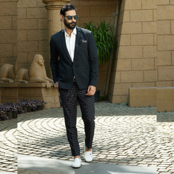 Black horizontal stripe textured blazer. It is accessorized with a chess piece brooch and a fabric flower. A chess embroidered pocket square completed the look.