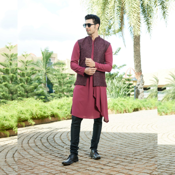 Burgundy hand embellished open pattern jacket. It is enhanced with knots and pearl all over.