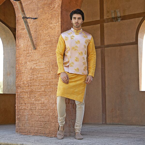 Old rose jacket with yellow flower overlapped straight hemline and sequence detailing. It is paired with tuskan yellow embroidered kurta.