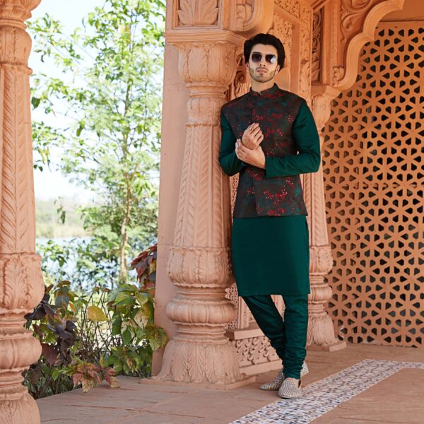 Emerald green basic jacket with read knot and sequence detailing in flower paired with emerald green kurta.