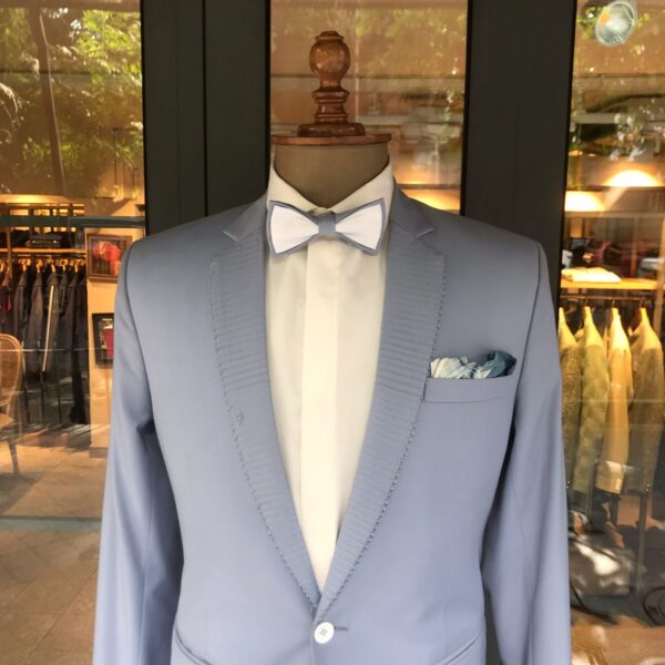 Sky blue single button blazer with horizontal thread work on lapel & accessorised with a bow & pocket square - Image 2