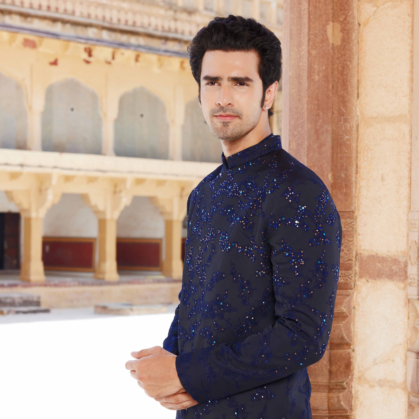 Midnight blue overlapped asymmetrical textured bandhgala with sequence detailing paired with coordinated short kurta. Matching trousers for bottom. Styled with coordinated loafers with antique gold embroidery - Image 2