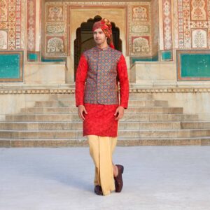 Printed overlapped jacket with sequence & thread detailing all over. The ensemble is paired with surface detailing of Forts embroidered sienna kurta. Beige dhoti for bottoms. Accessorised with coordinated safa. Styled with brown loafers.