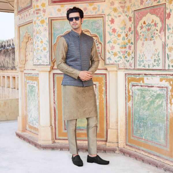 Inspired by the AkGrey printed jacket with criss cross stitch line detailing all over. Paired with time travel space embroidered copper kurta. Copper trousers for bottom. Styled with black loafers.