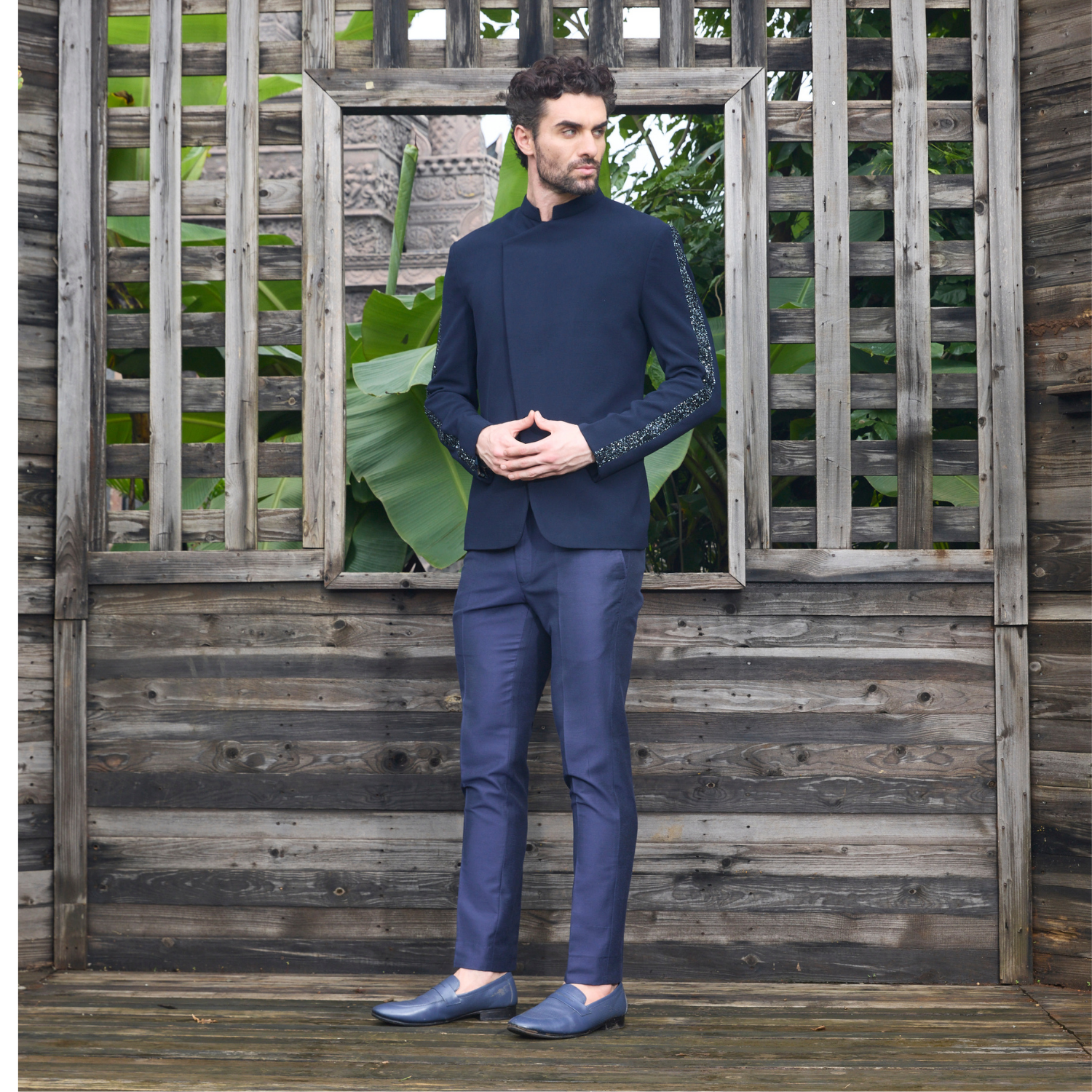 Midnight blue Jodhpuri with bugle beads embellished on both sleeves & flap pocket. Paired with matching trouser.