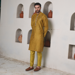Sanctum gold  kurta with all over surface detailing of Medieval in monotone look with Hops and Leaves embroidered in antique gold on the placket. Slim fit trouser completes the look.