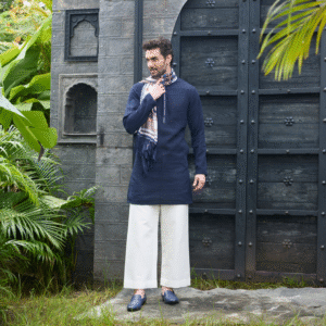 Midnight blue translucent kurta with white placket deatiling.The ensemble is paired with matching trouser & accessorised with a scarf.
