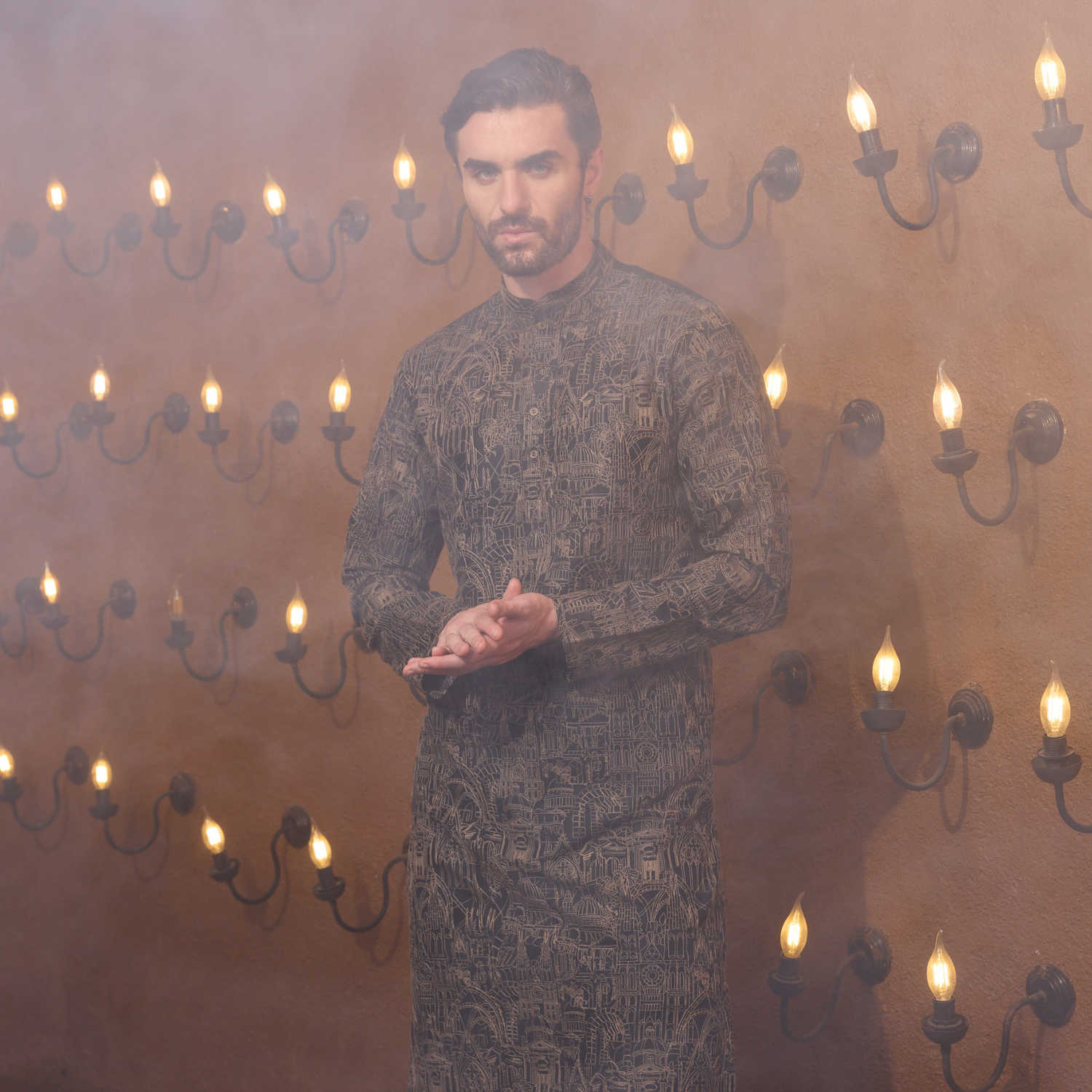 All over surface detailing kurta of Medieval embroidery in antique colour. The enseble is teamed up with black trouser. - Image 2