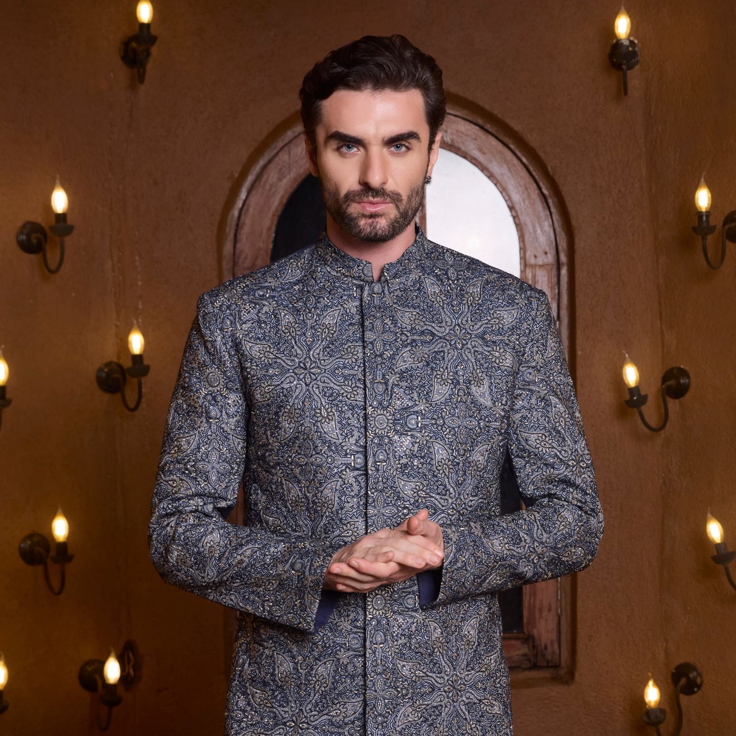 Full hand embroidered midnight blue short Bandhgala paired with coordinated trouser.