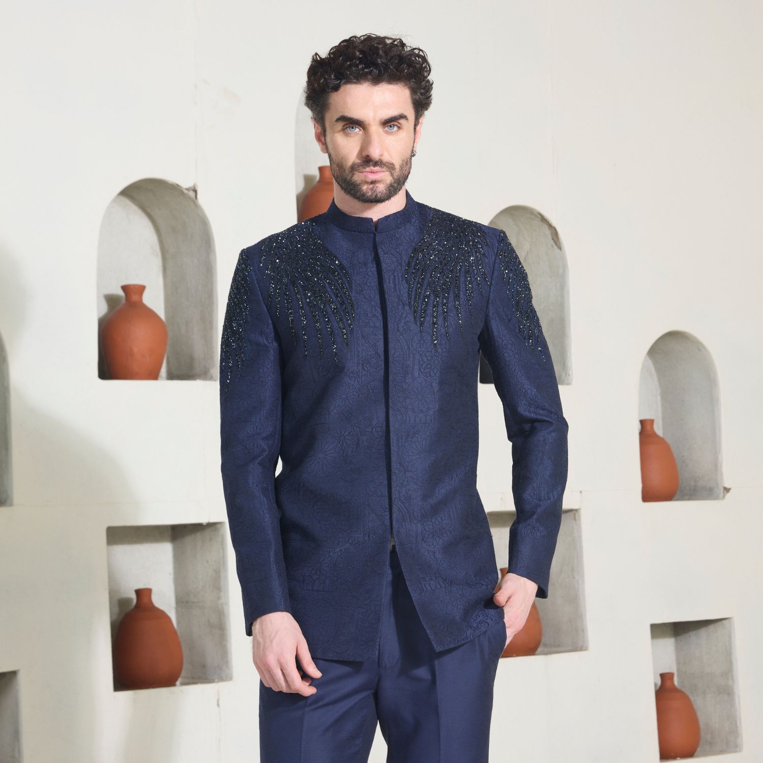 Midnight blue Jodhpuri with all over surface detailing of Quatrefoil in monotone look. Wings of Eternity embelished in bugle beads on shoulder & sleeve. The ensemble is paired with midnight blue trouser. - Image 2