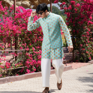 Flortal motif printed aqua blue Hopsack embroidered jacket with pearl detailing all over. Paired with matching kurta and flared ivory trouser.