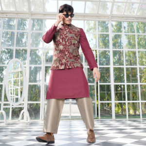 Printed burgundy jacket teamed up with burgundy Hopsack embroidered kurta with sequins detailing in front. Coordinated flared copper trouser for bottom.
