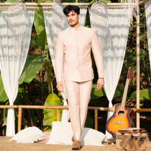 Old rose Hopsack embroidered Jodhpuri coat. Paired with matching trouser.