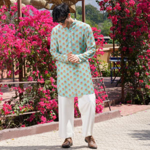 Floral motif printed aqua blue kurta. Paired with flared ivory trouser.