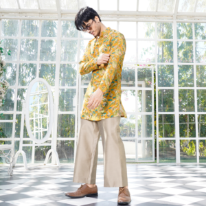 Printed short Tuscan yellow kurta paired with coordinated flared copper trouser.