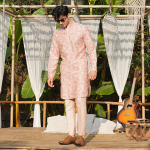 Old rose Milange embroidered kurta with round hemline. Paired with matching trouser.