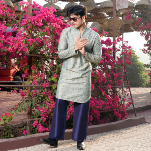 Pearl grey Milange embroidered kurta with round hemline. Paired with coordinated flared midnight blue trouser.