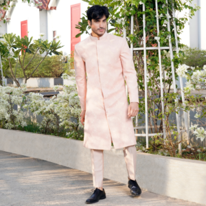 Old rose Hopsack embroidered bandhgala with sequins detailing at bottom and sleeve. Paired with matching trouser.